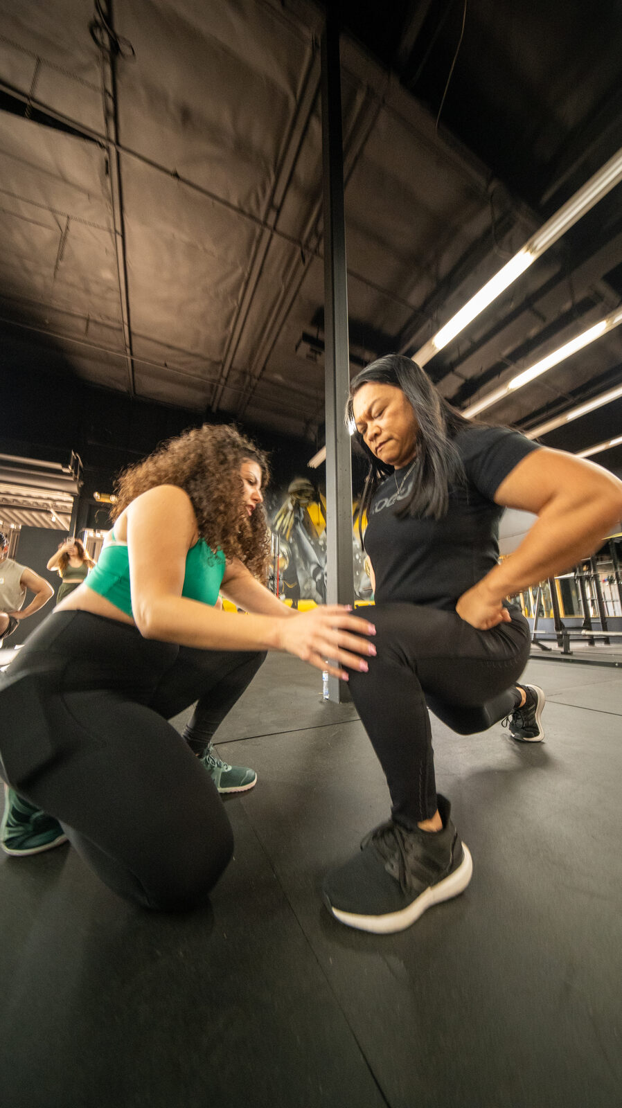 Narine coaching a client at her gym in Burbank, CA